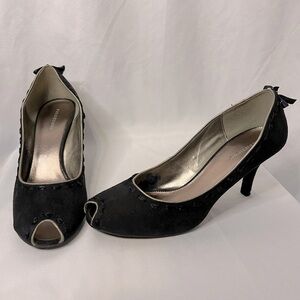 Black suede slip-on heels with ribbon detail and gold trim